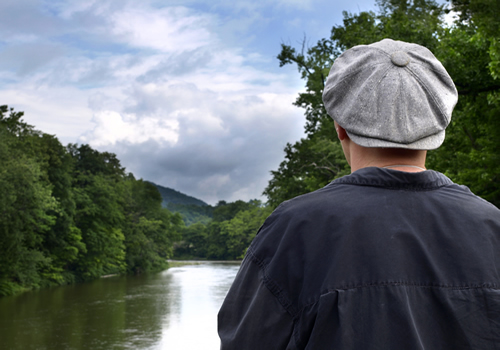 pete standing in front of creek